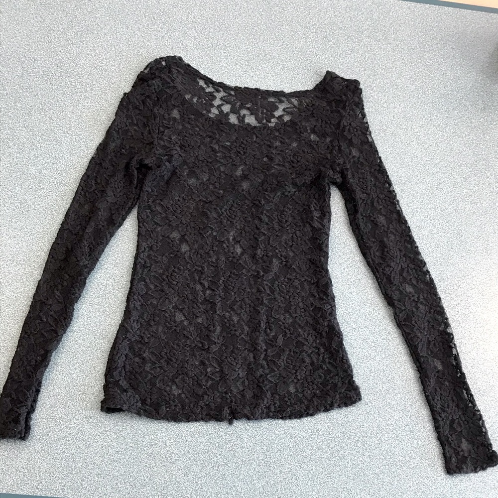 Lace-style long sleeved top.